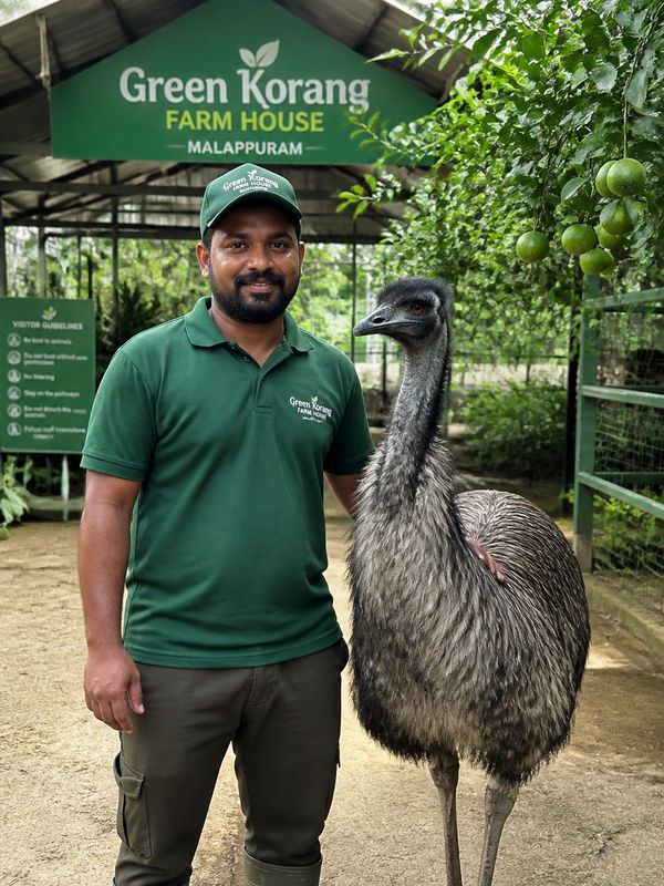 Manavas with an emu at Kasavi Paradise farm house in Malappuram