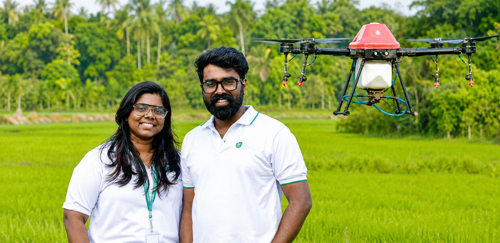 Dronilex founders Devan Pazhakkaran and Sahori Devadas with their agricultural drone Krishi Upyogikaran